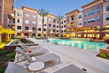 Two sparkling swimming pools with sundeck